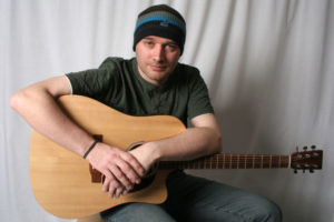 John Moxey with his Martin Guitar